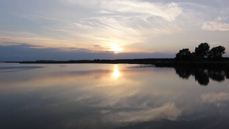 Sunset over calm lake