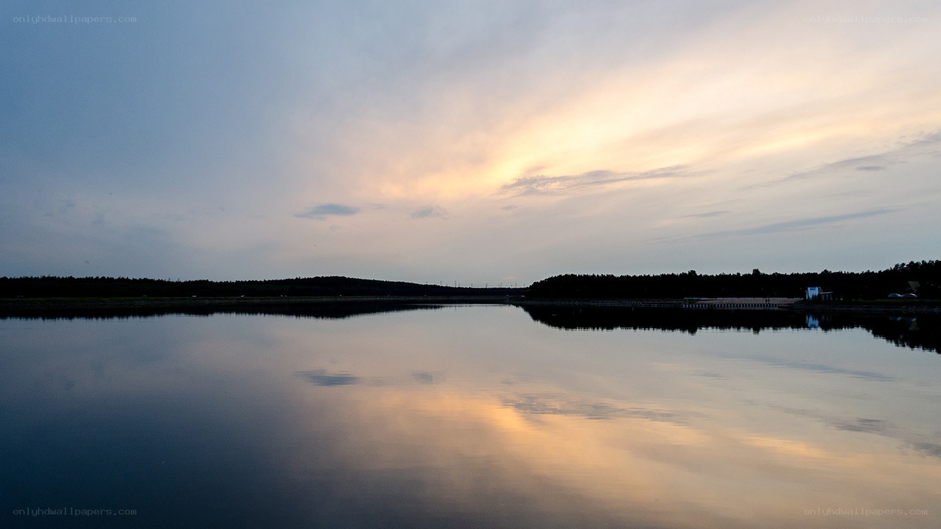 sunset over calm lake