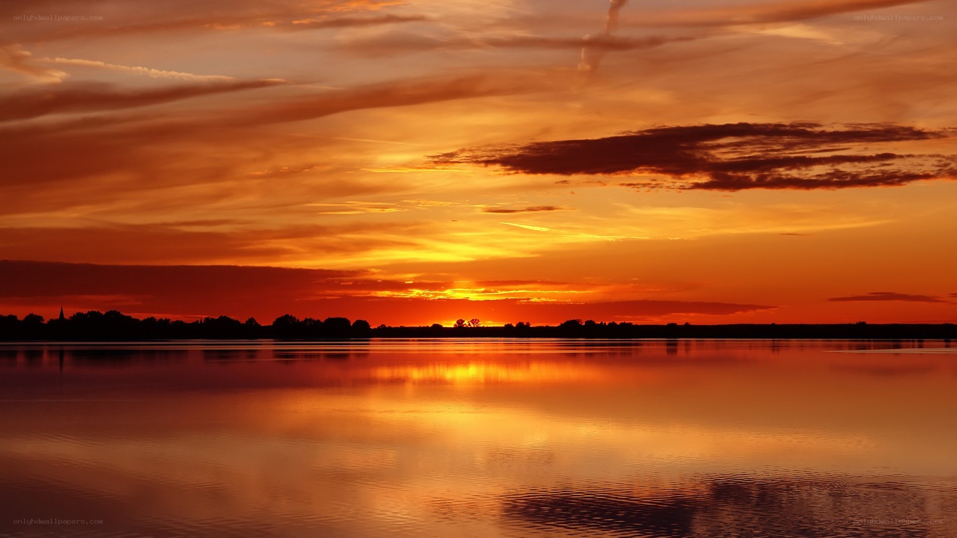 sunset over calm lake