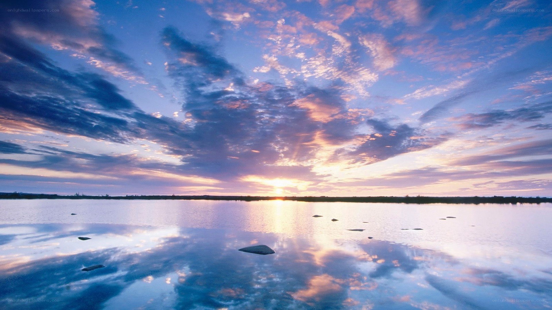 Sunset over calm lake