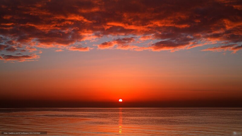 sunset over calm ocean