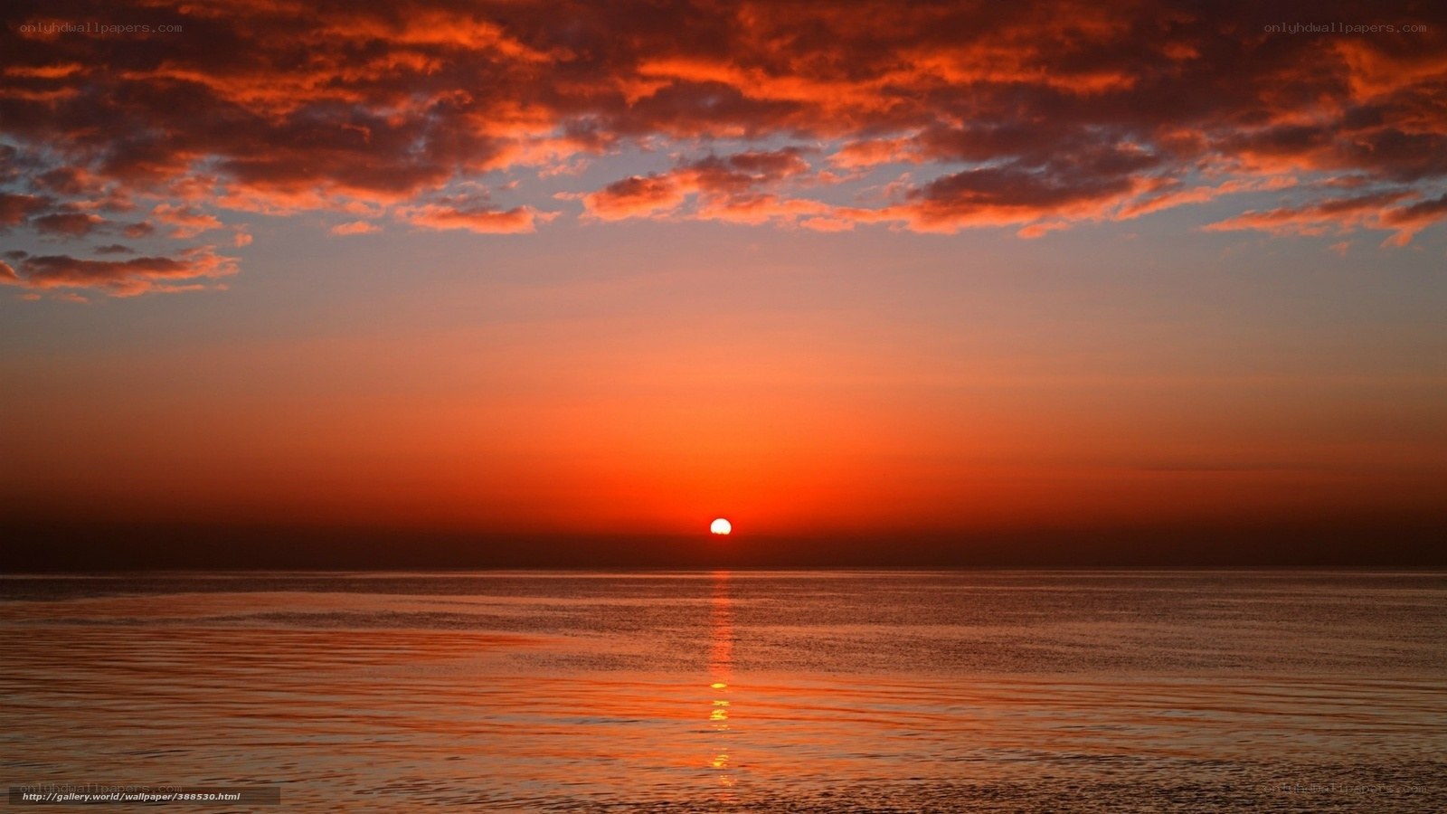 Sunset over calm ocean