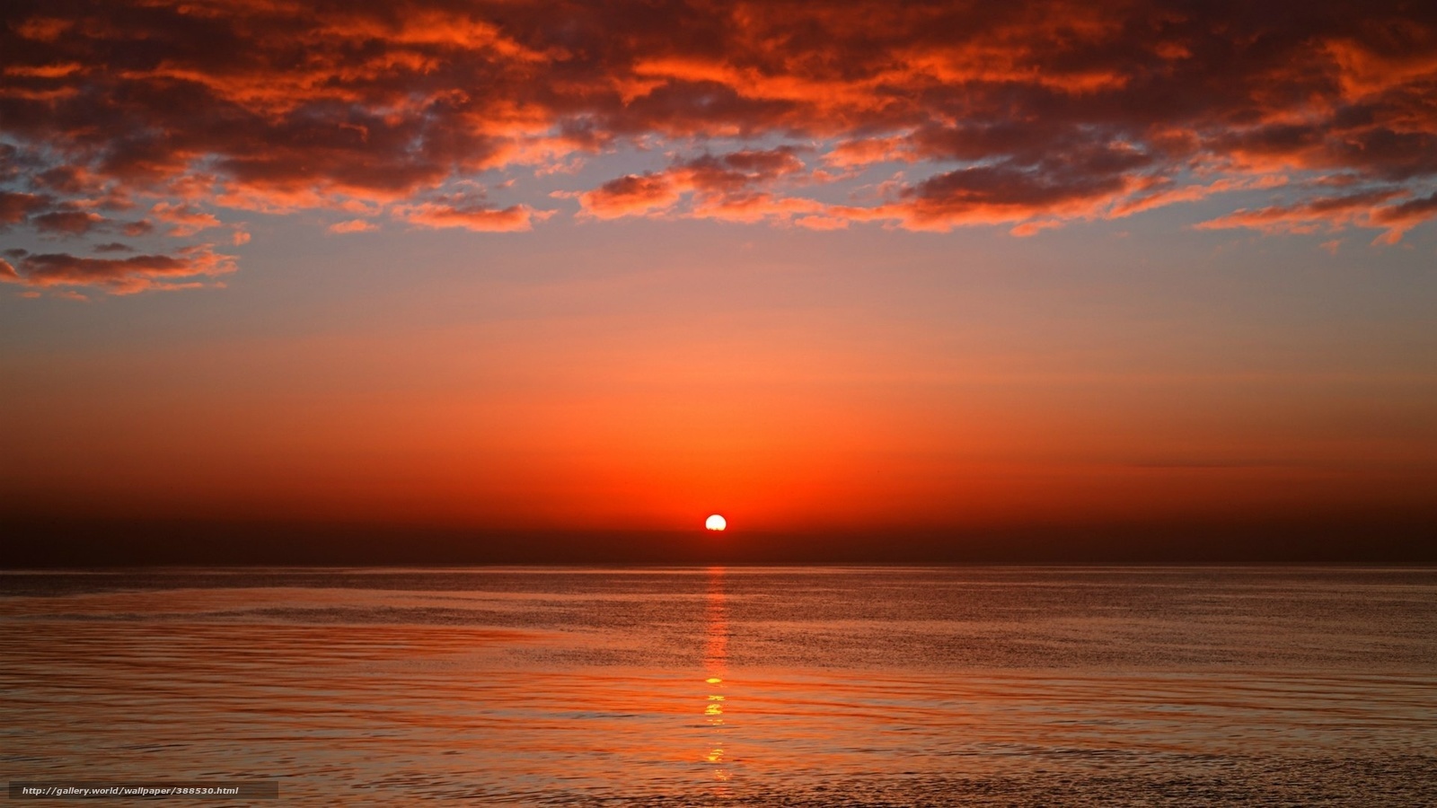 Sunset over calm ocean