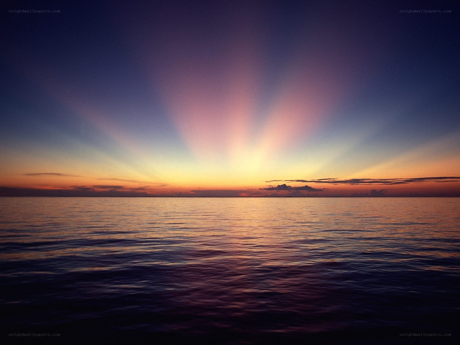 Sunset over calm ocean