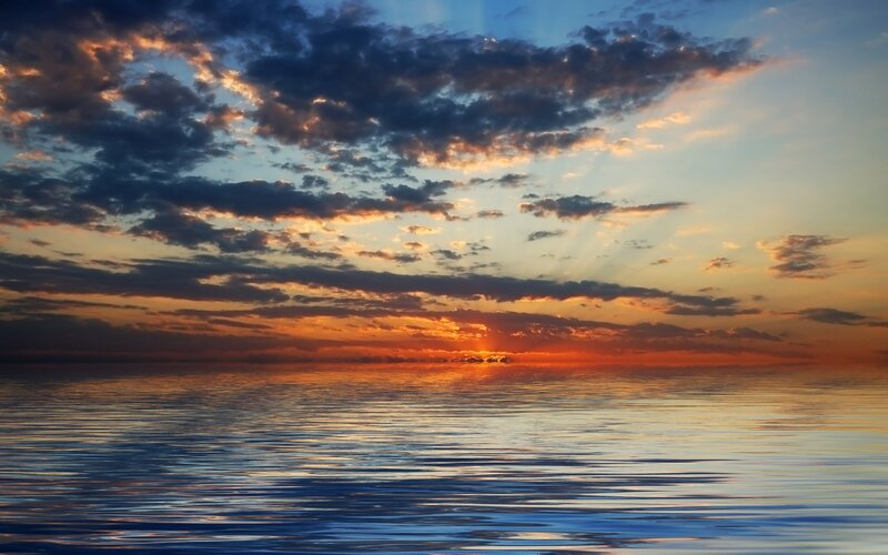 Sunset over calm ocean