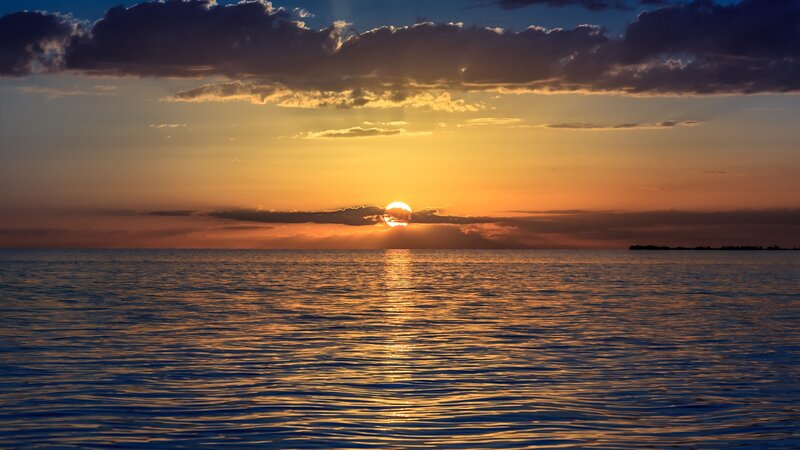 Sunset over calm ocean