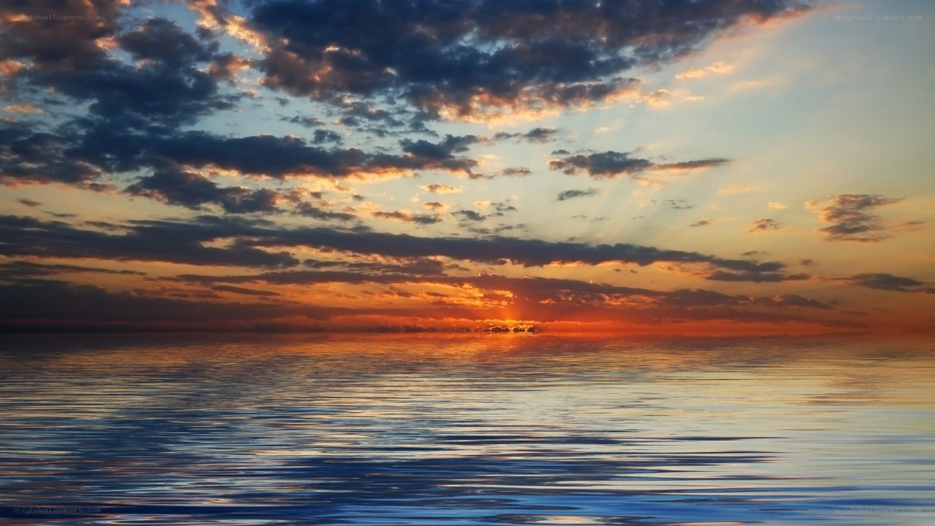 sunset over calm ocean