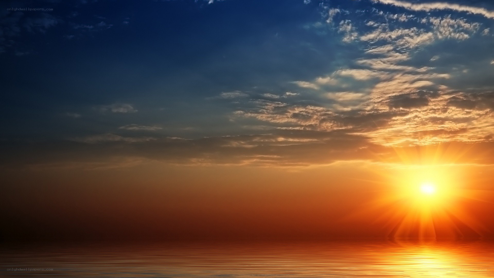 sunset over calm ocean