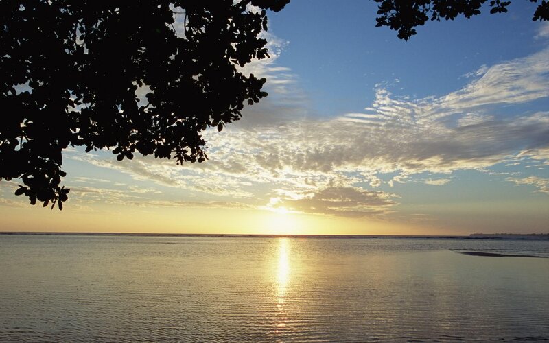 sunset over calm ocean