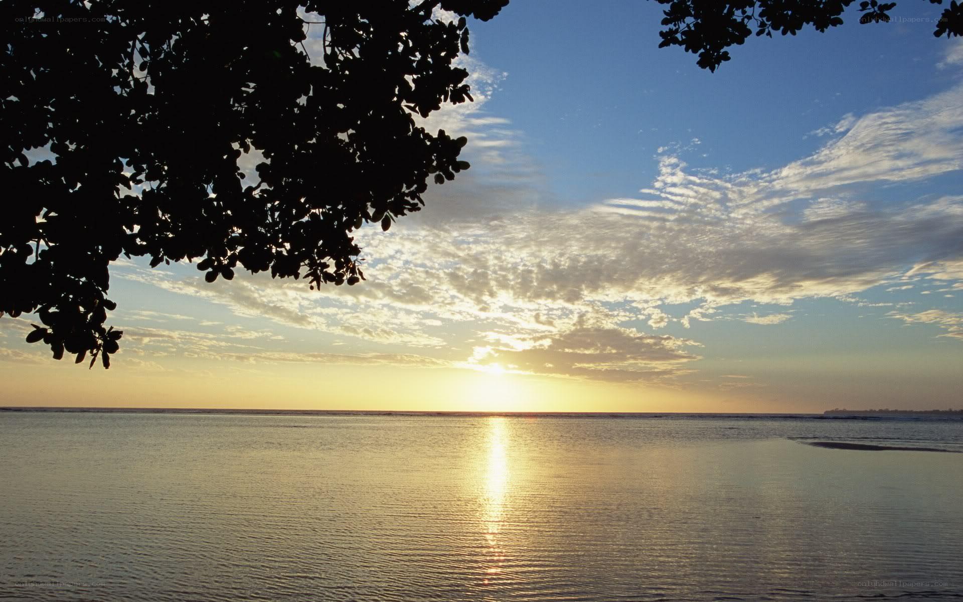 sunset over calm ocean