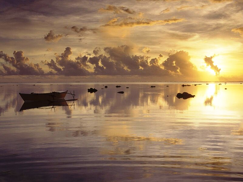 Sunset over calm ocean