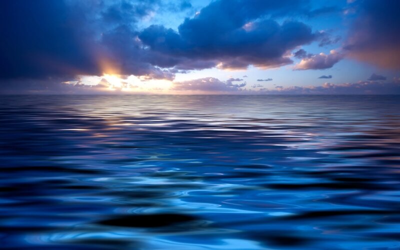 Sunset over calm ocean