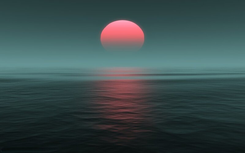 sunset over calm ocean