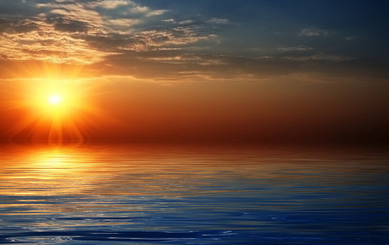 Sunset over calm ocean