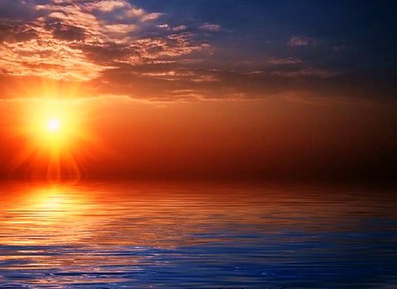 sunset over calm ocean