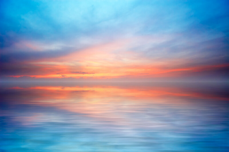 sunset over calm ocean
