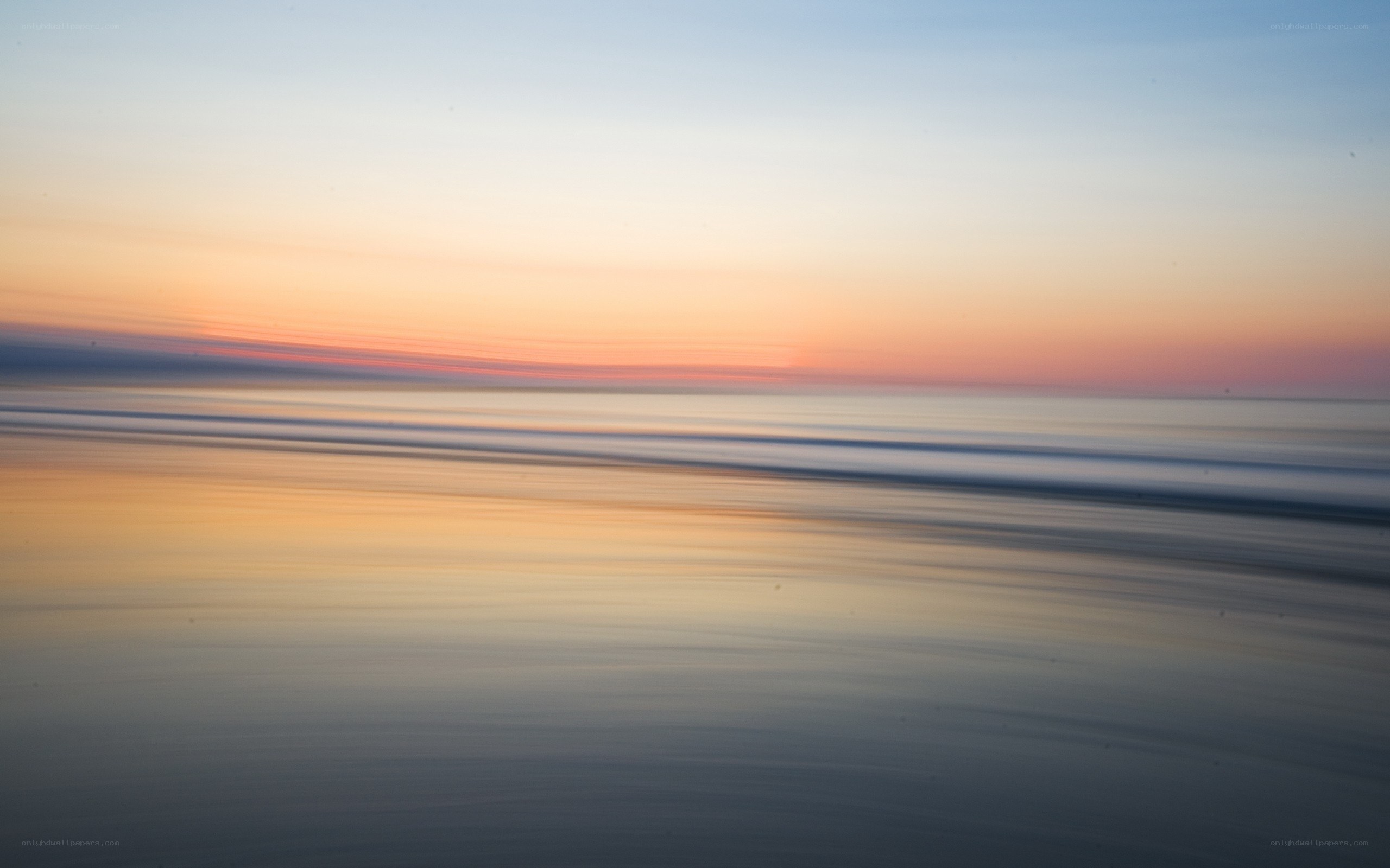 Sunset over calm ocean