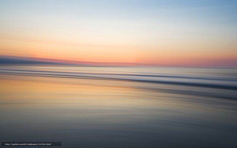 Sunset over calm ocean