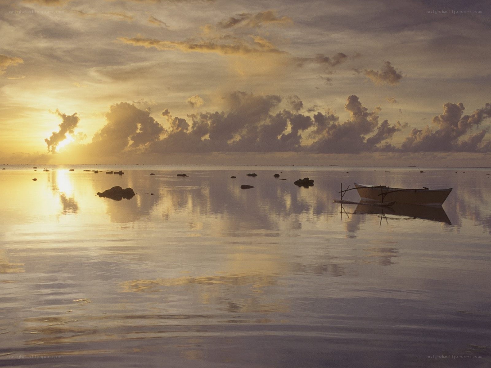 Sunset over calm ocean waters