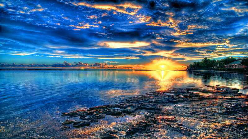 sunset over calm ocean waters