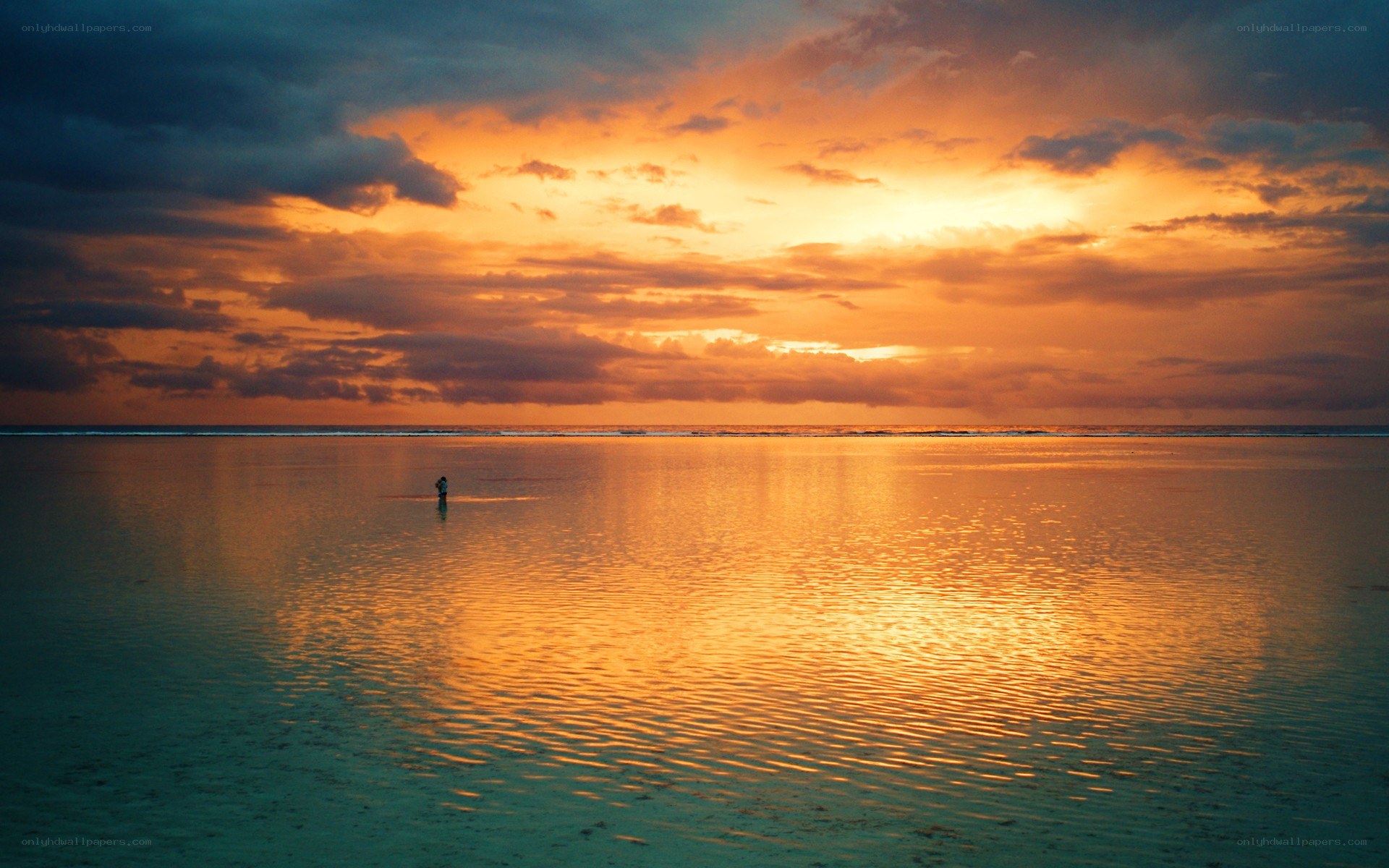Sunset over calm ocean waters