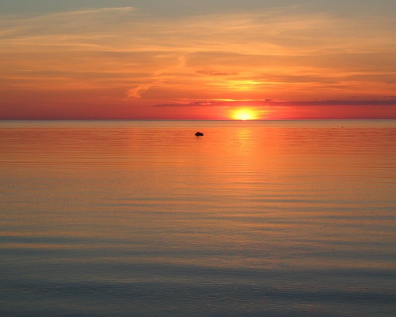 Sunset over calm sea