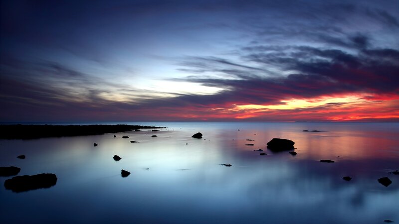 Sunset over calm sea