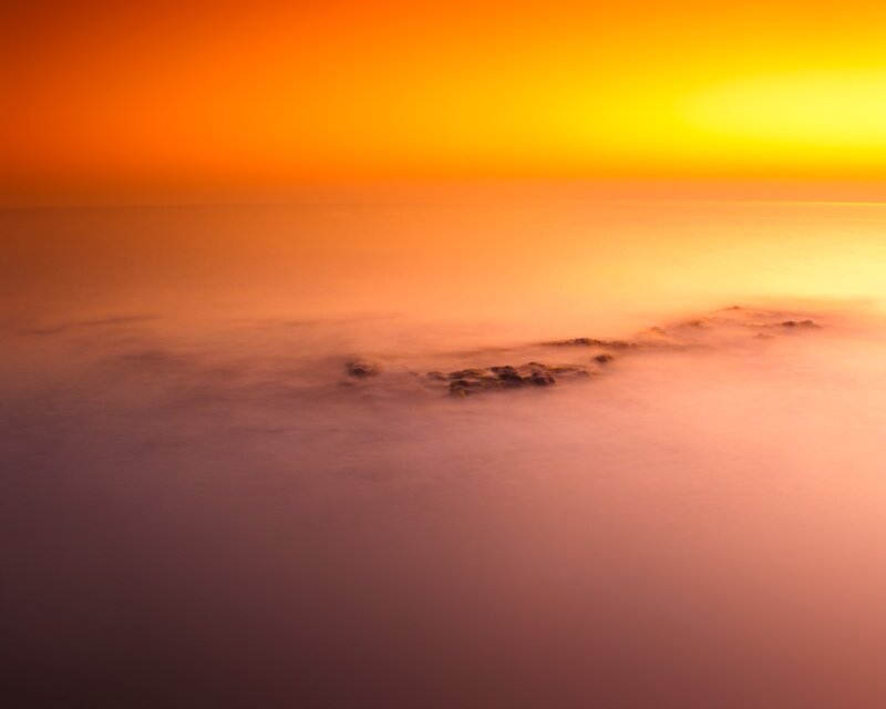 Sunset over calm sea