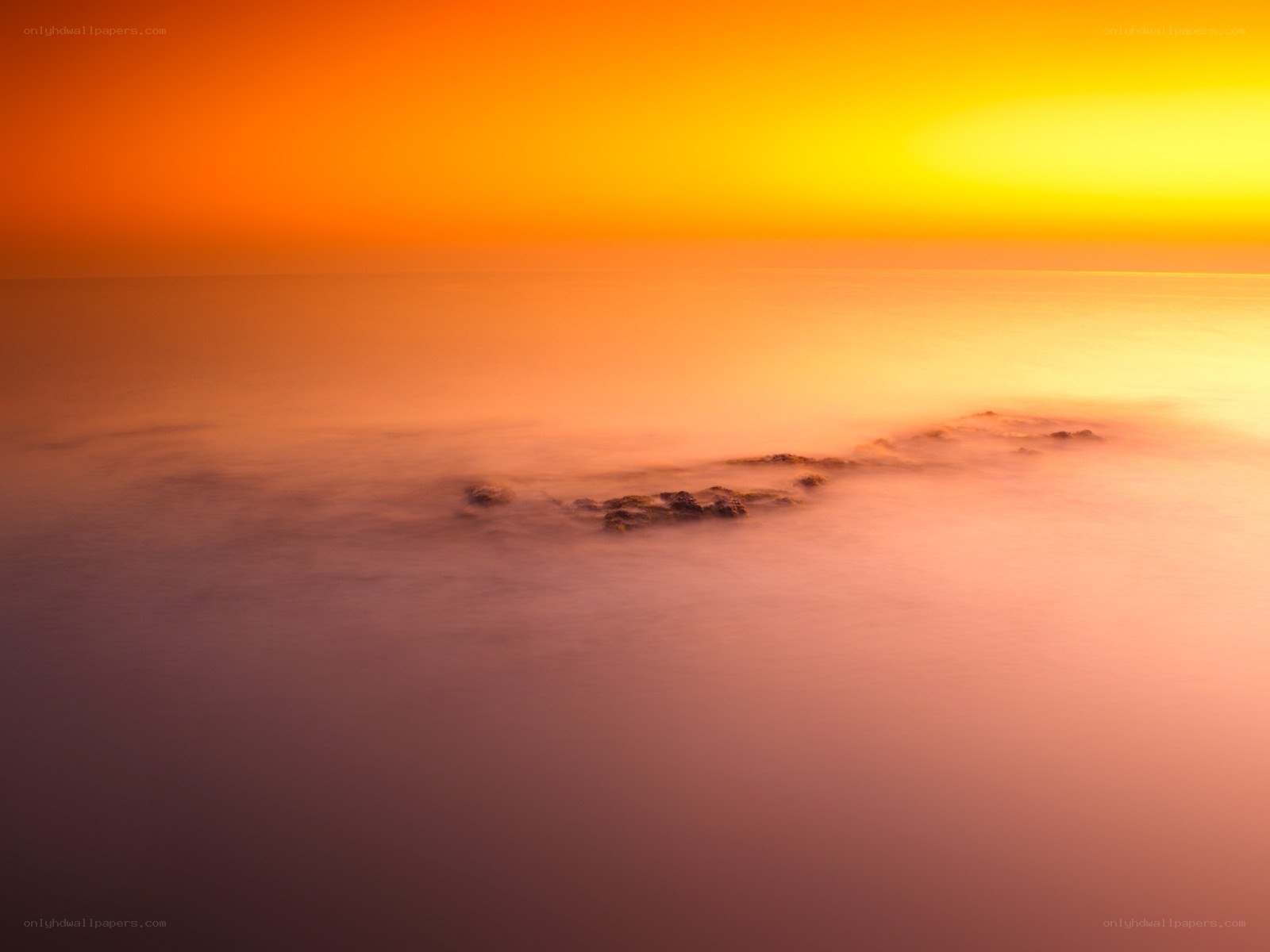 Sunset over calm sea