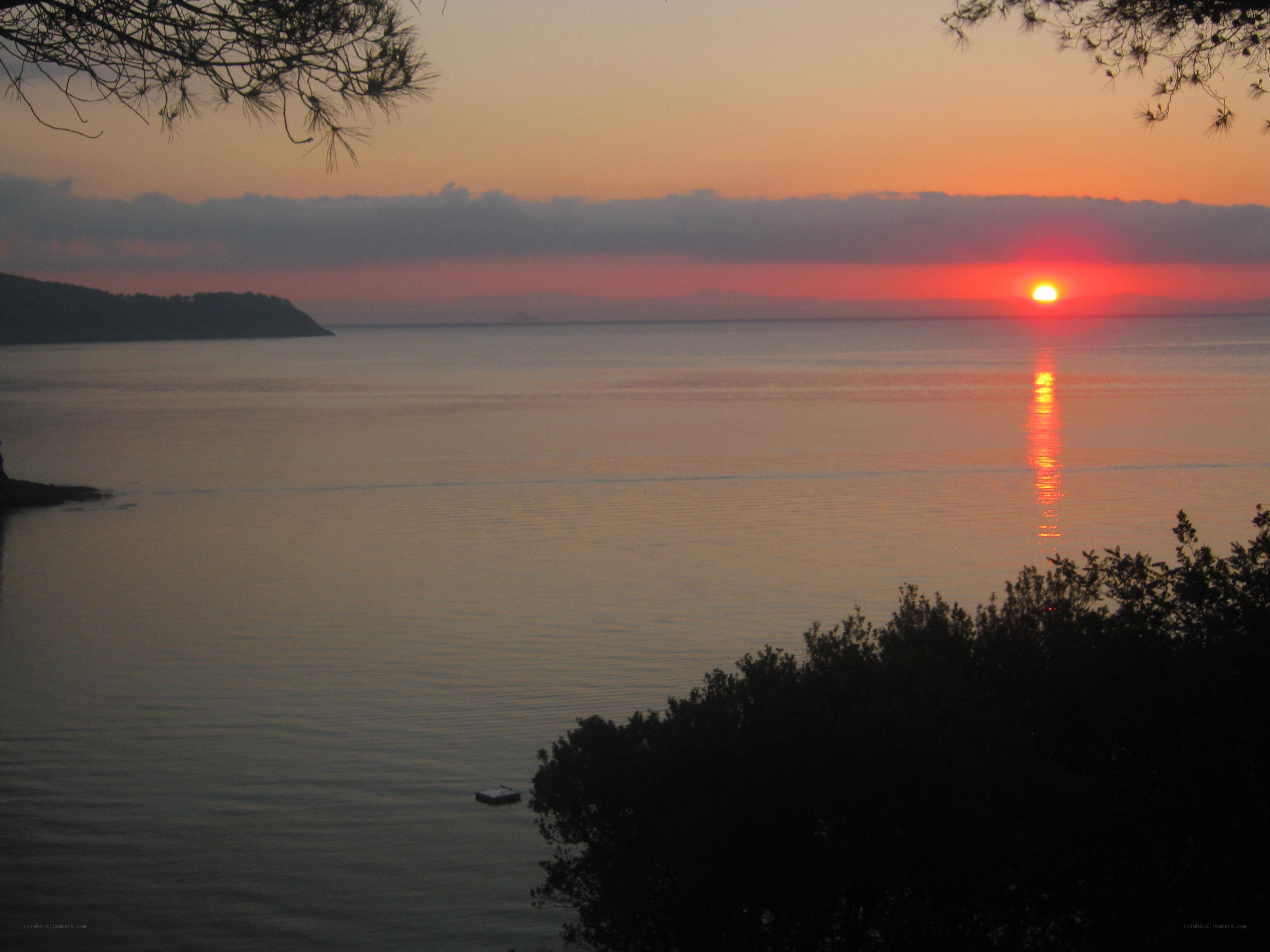 sunset over calm sea