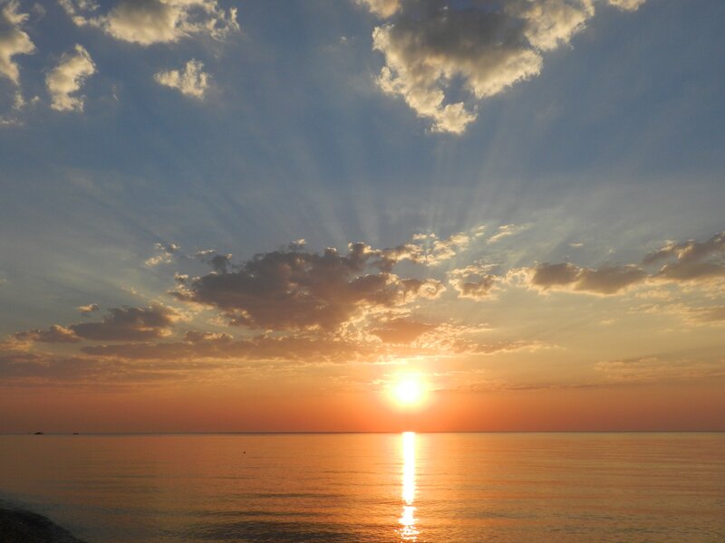 sunset over calm sea