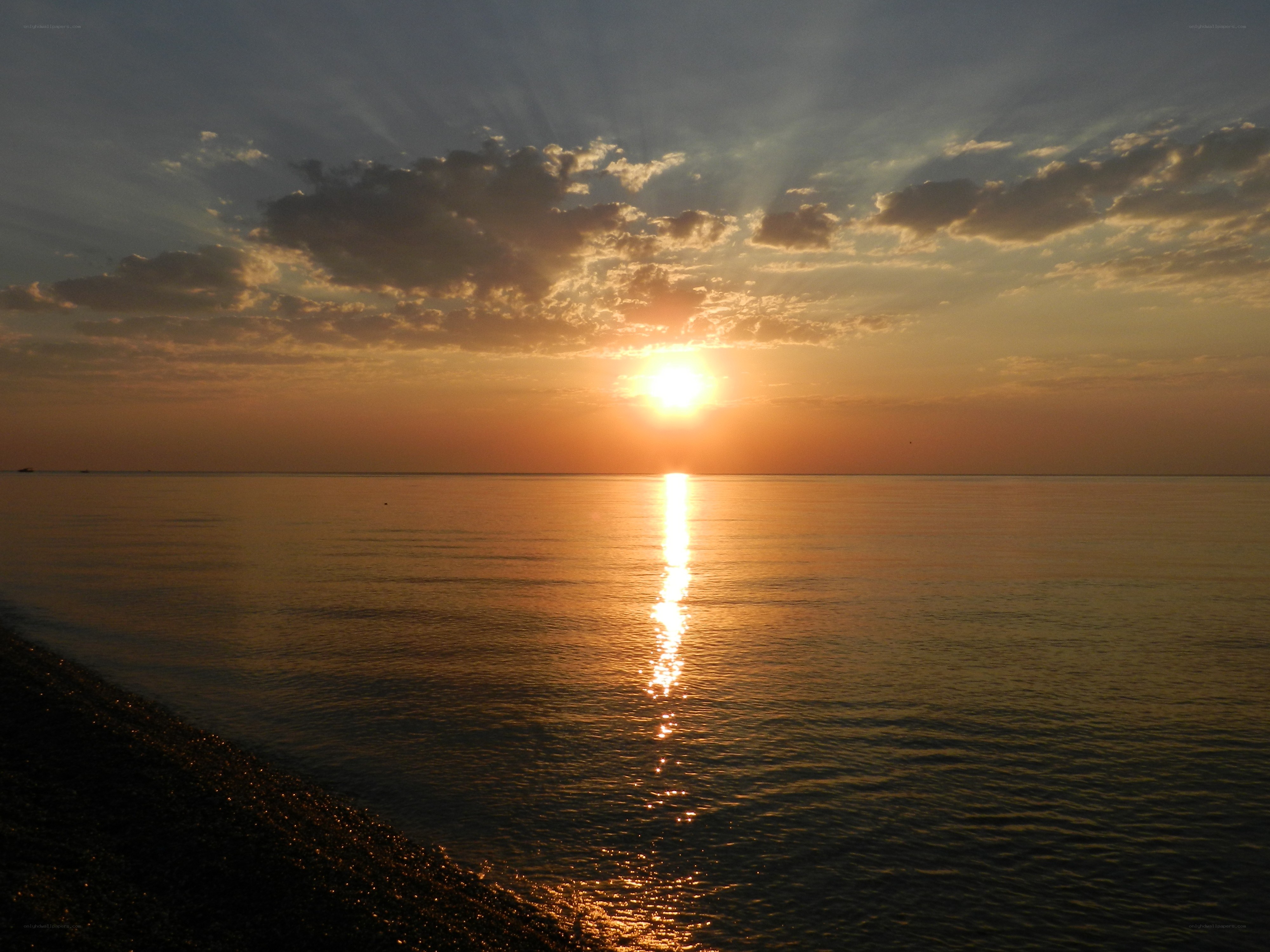 Sunset over calm sea