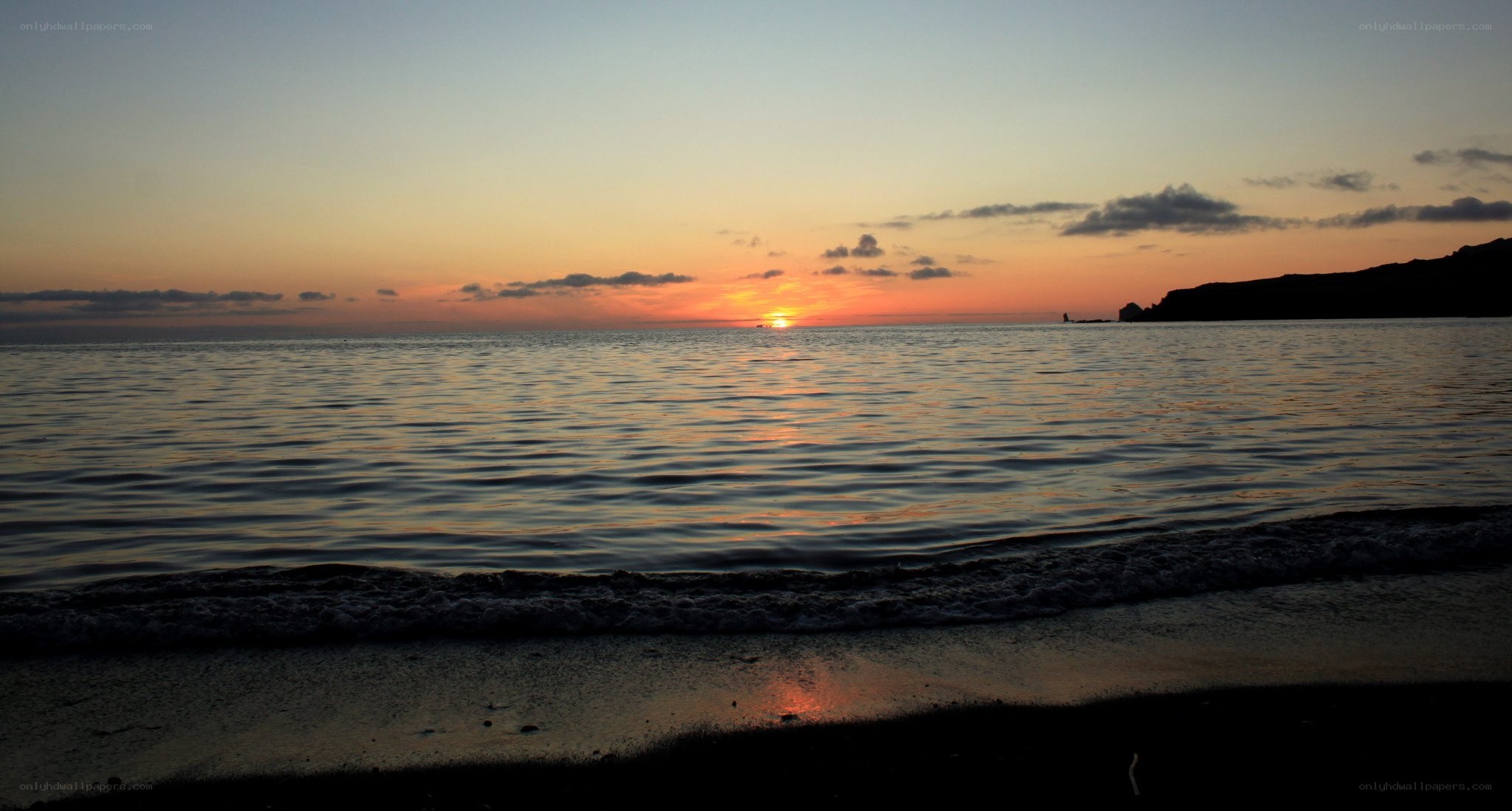 sunset over calm sea