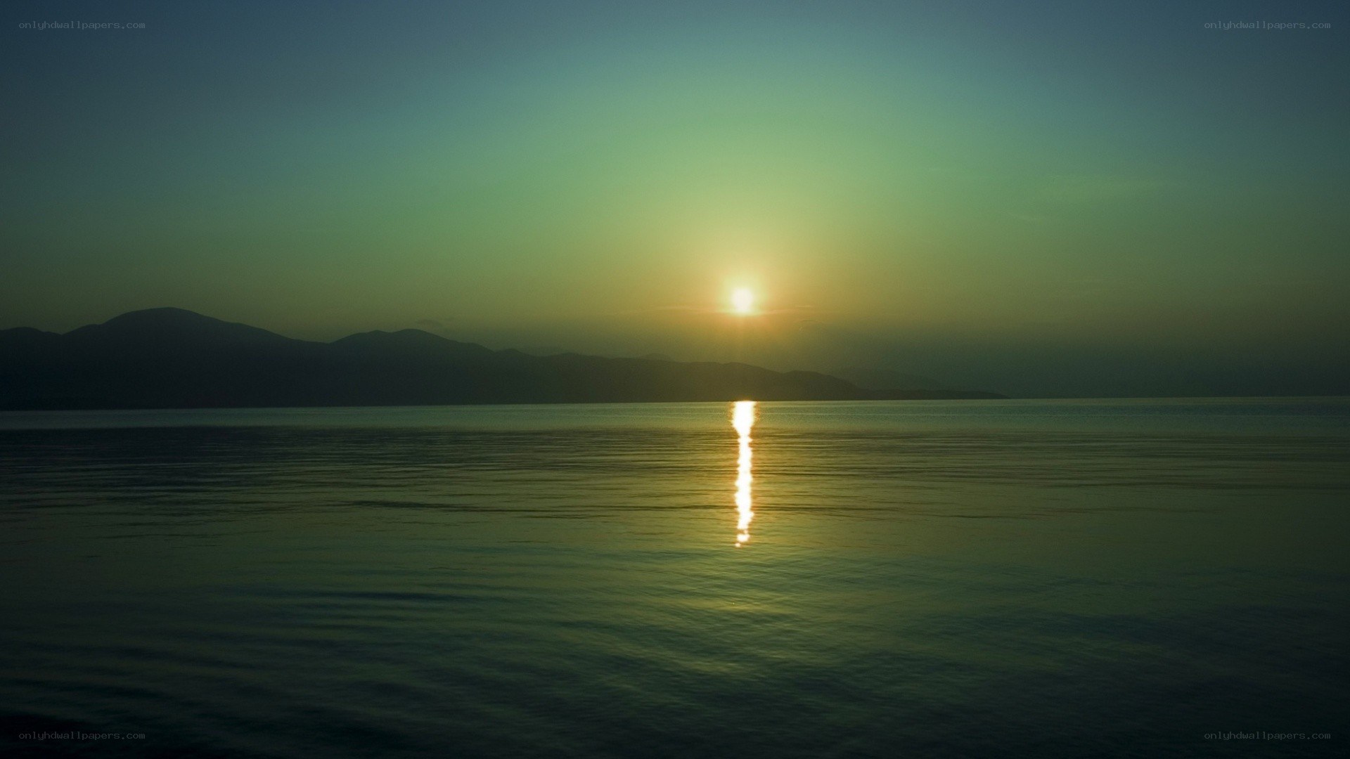 Sunset over calm sea