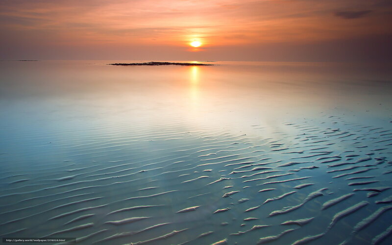 Sunset over calm sea