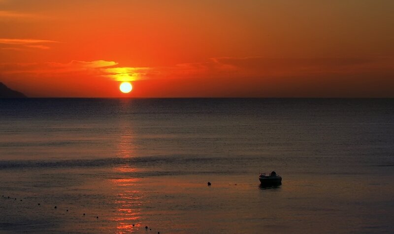 Sunset over Calm Sea — Orange, Serene, Photograph, Sun, Boat