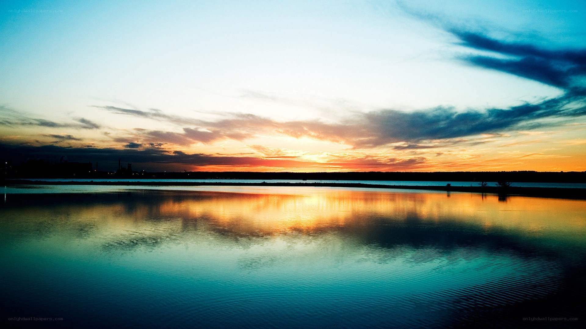 sunset over calm water