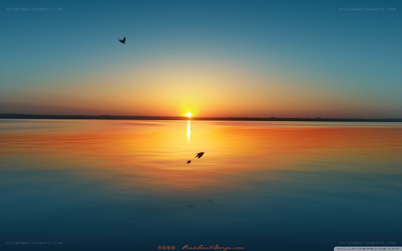 Sunset over calm water
