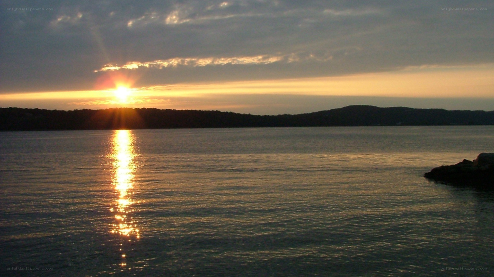 sunset over calm water