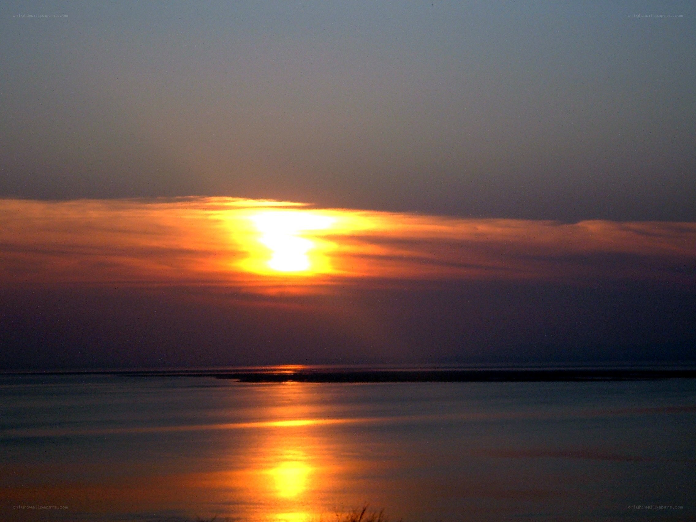 Sunset over calm water
