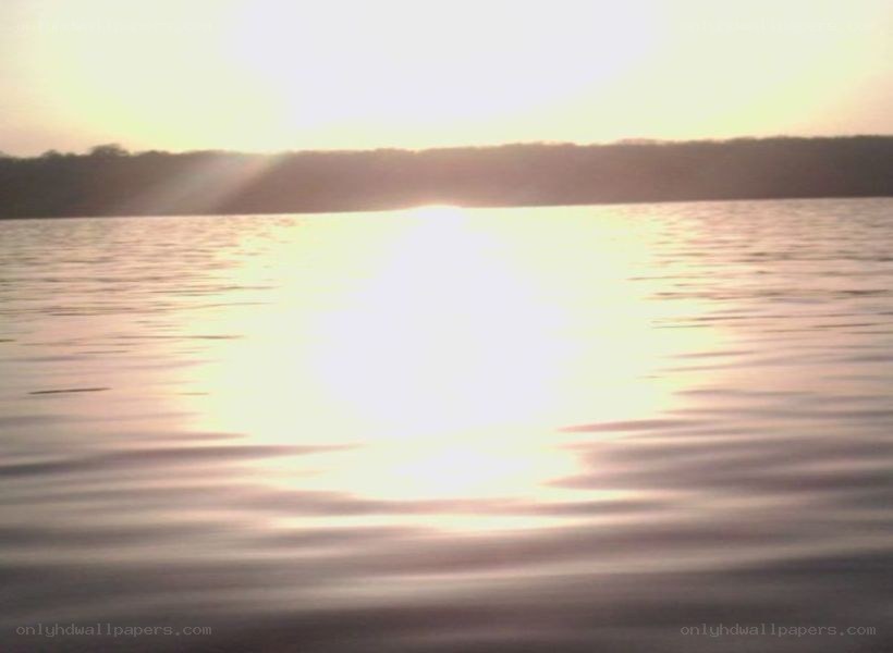 Sunset over calm water
