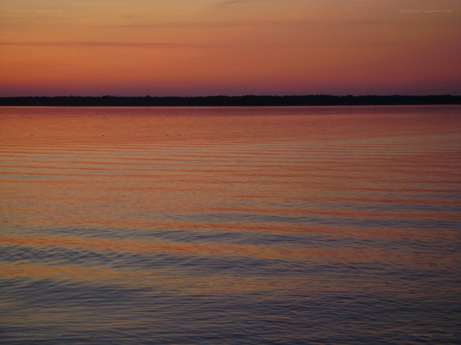 sunset over calm water