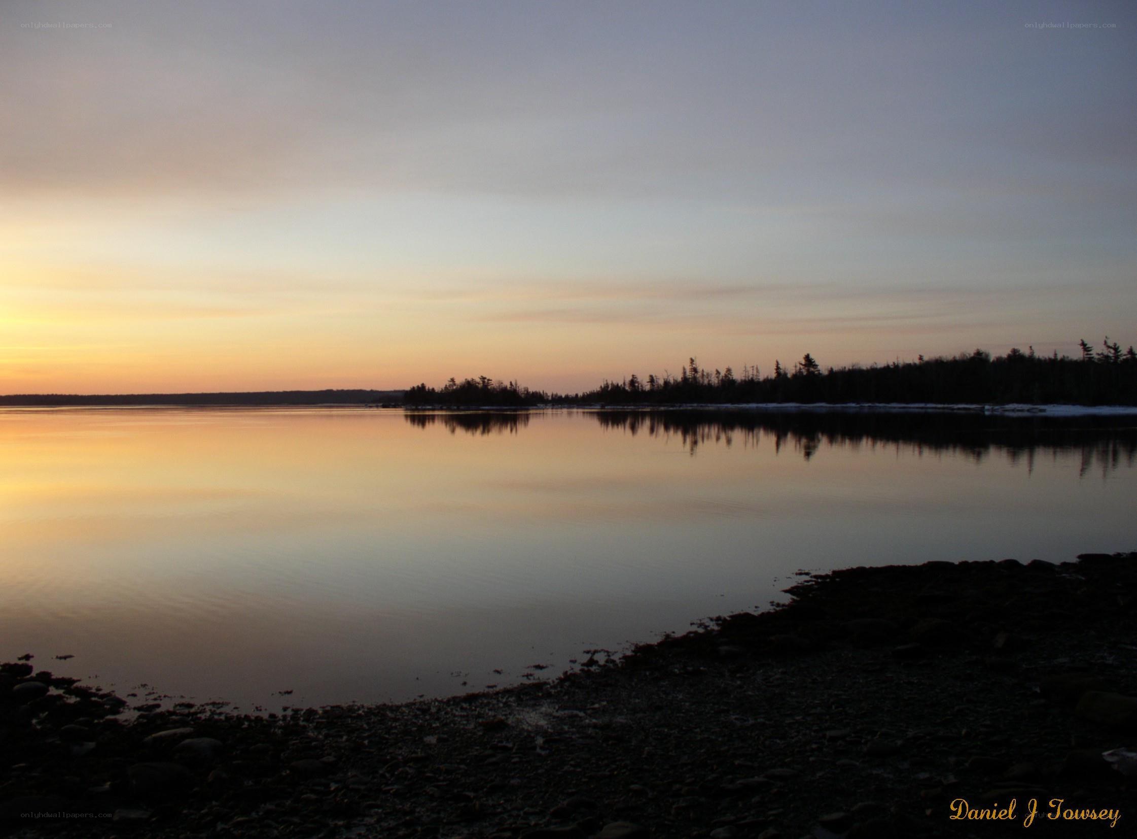 sunset over calm water
