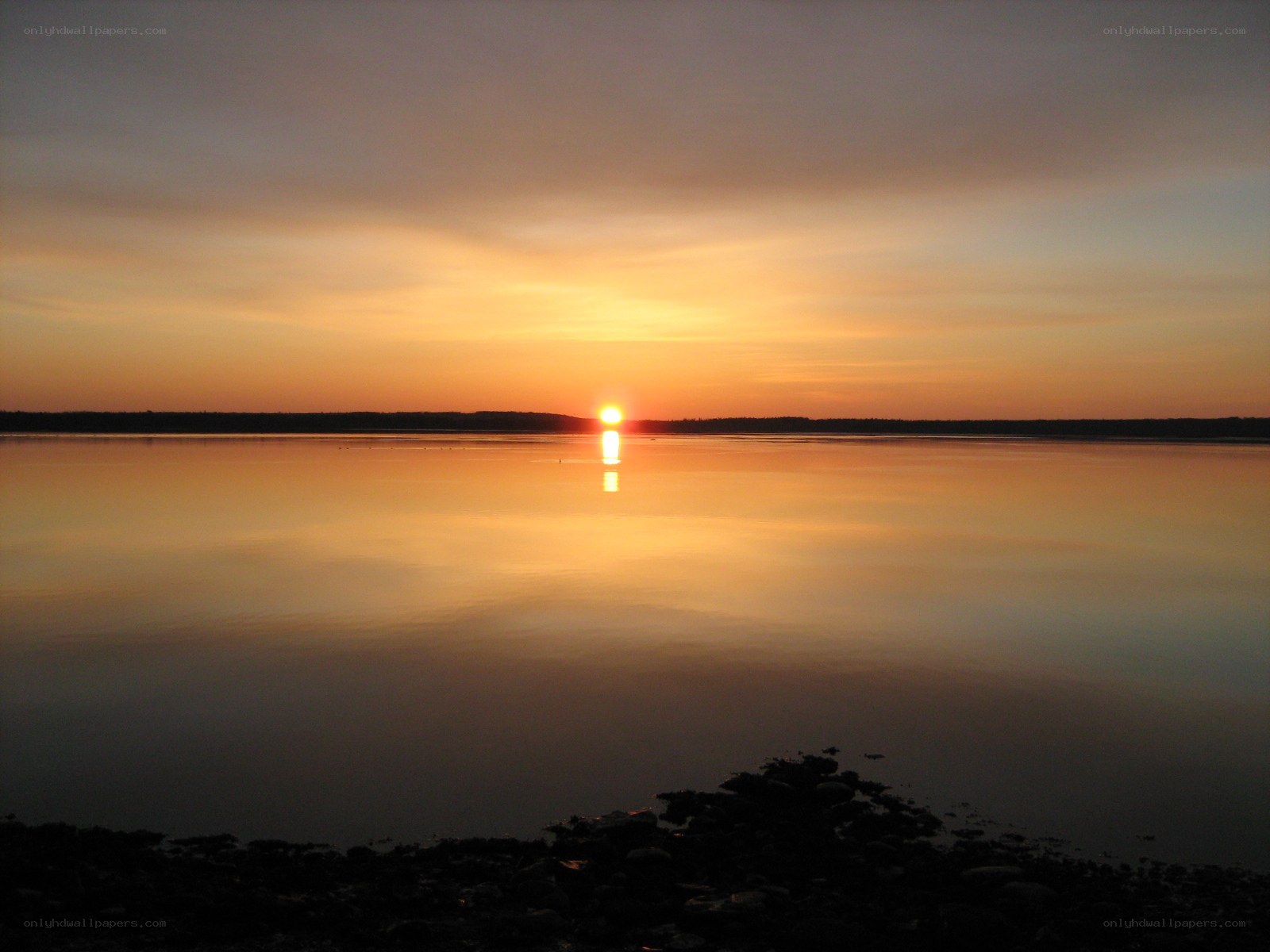 Sunset over calm water
