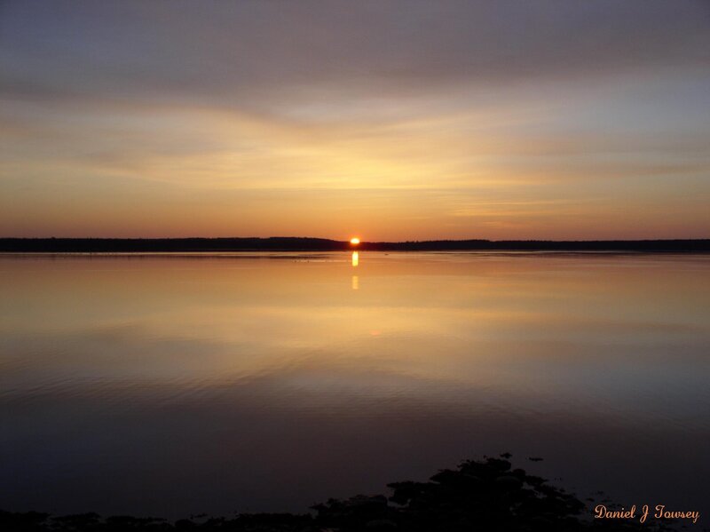 Sunset over calm water