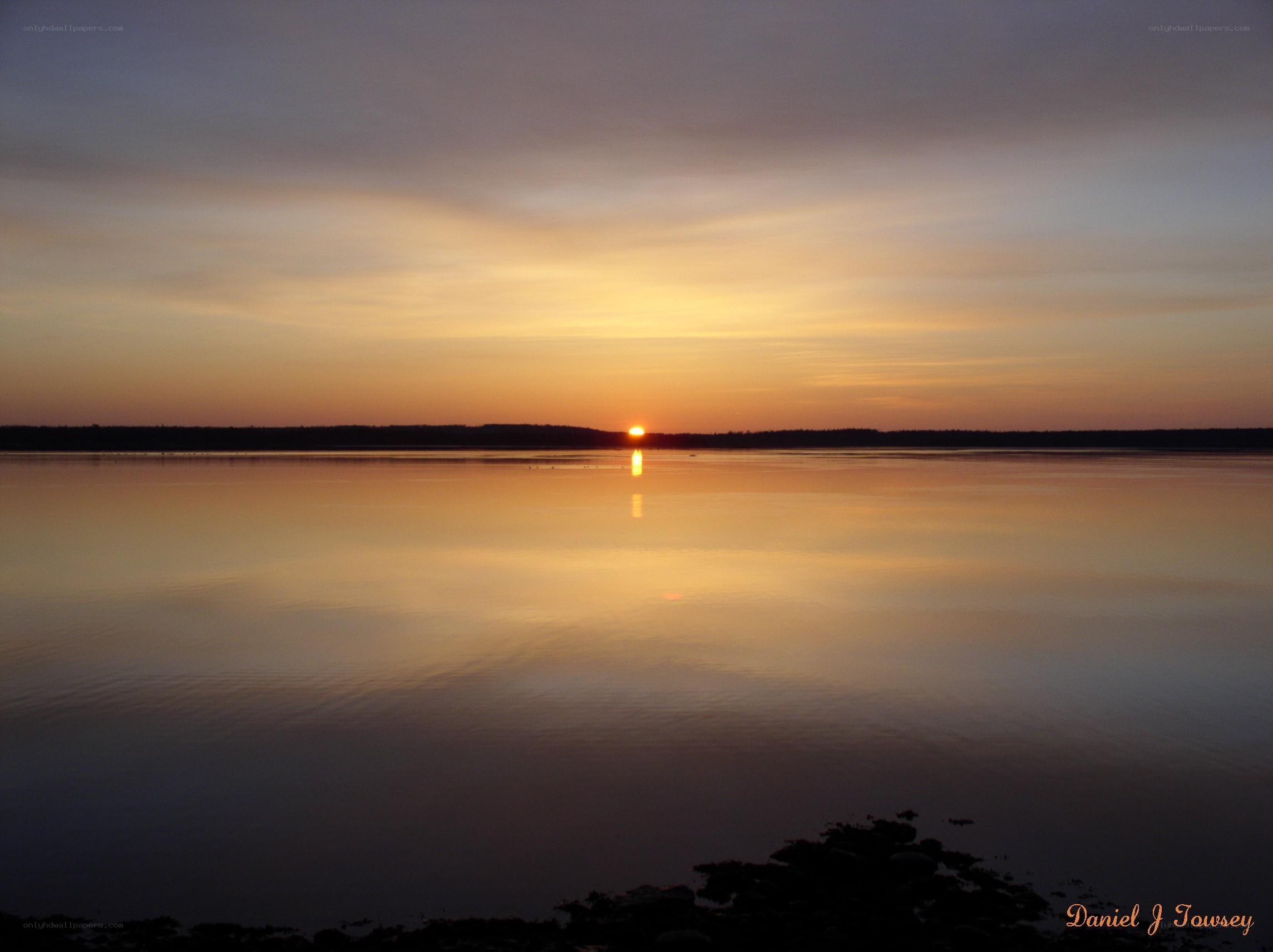 Sunset over calm water