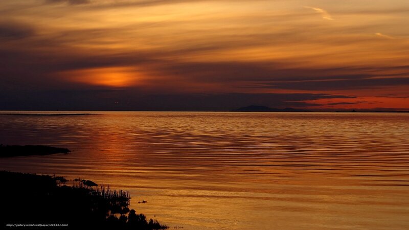 Sunset over calm water