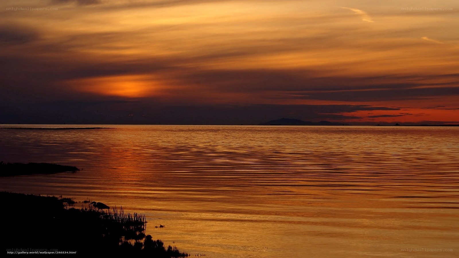 Sunset over calm water