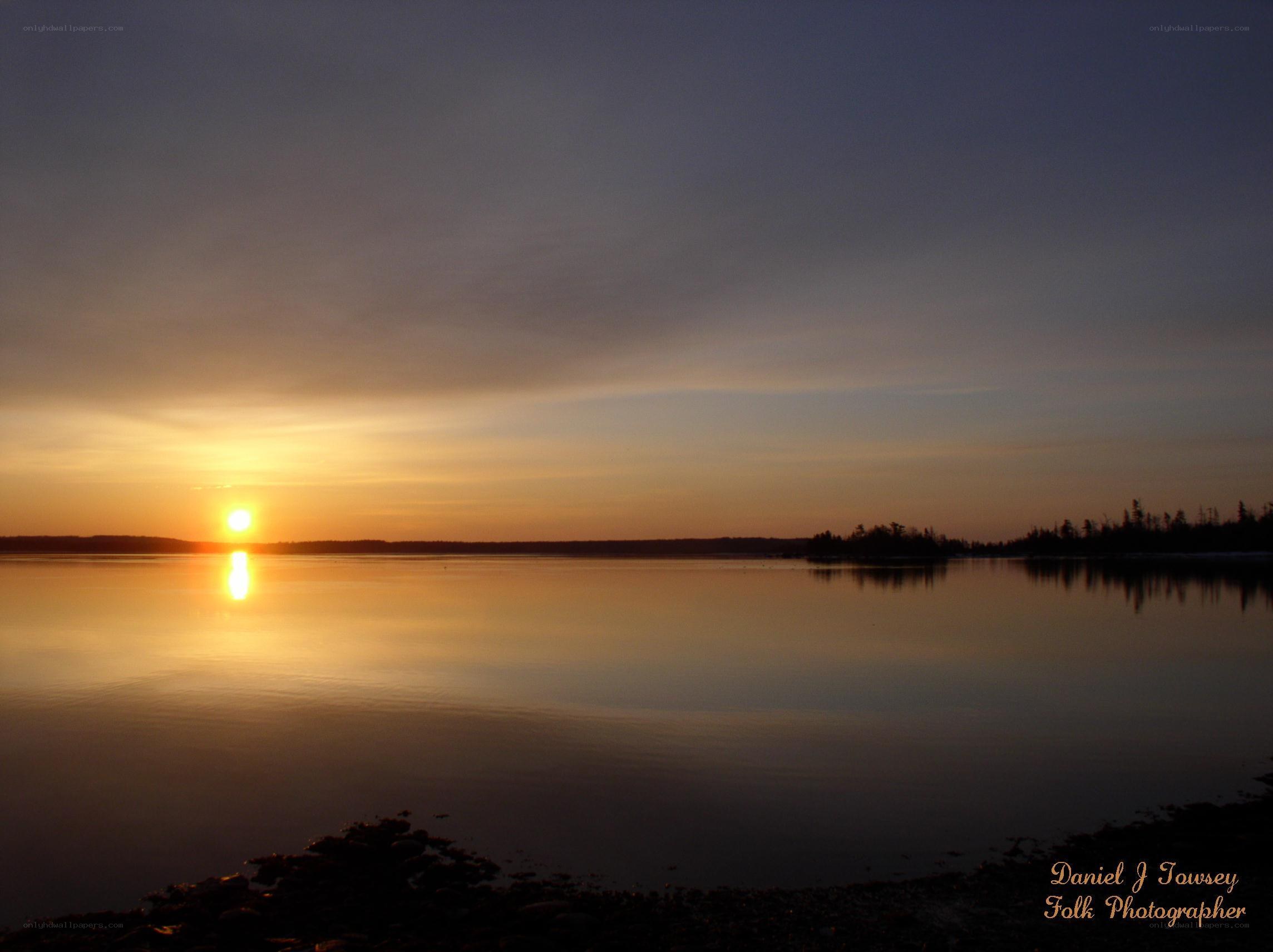 sunset over calm water