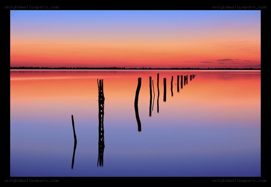 sunset over calm water